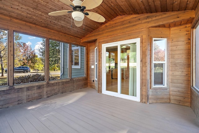 unfurnished sunroom with ceiling fan, wood ceiling, and lofted ceiling