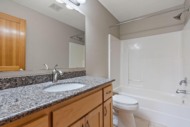 full bathroom featuring a textured ceiling, vanity, tile patterned floors, toilet, and shower / bathtub combination