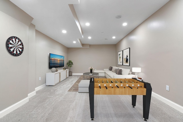 recreation room featuring light colored carpet