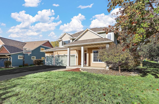 view of front of home featuring a garage and a front yard