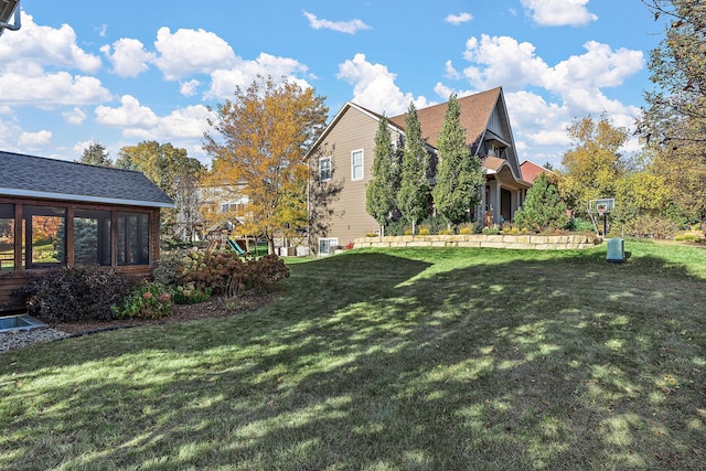 view of yard with a sunroom