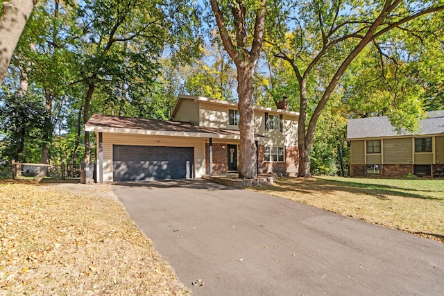 view of front of house with a garage and a front lawn