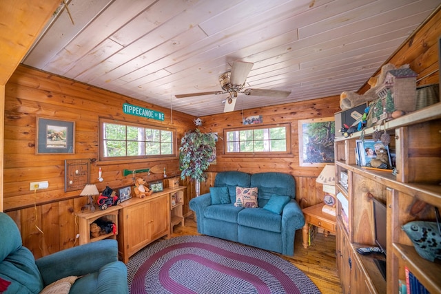 34779 County Road 39, Pequot Lakes, MN 56472 - living room with hardwood / wood-style floors, ceiling fan, wood ceiling, and wooden walls