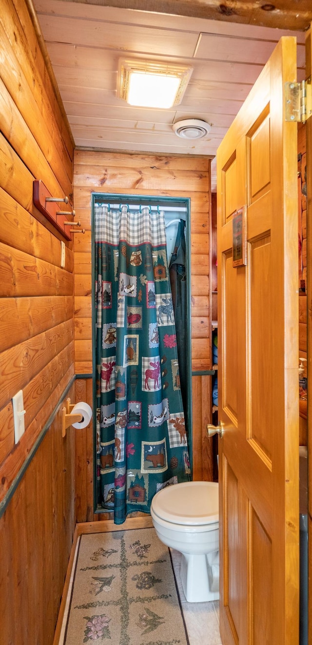 34779 County Road 39, Pequot Lakes, MN 56472 - full bath featuring toilet, wooden walls, wood ceiling, and a shower with shower curtain