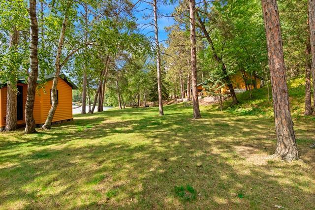 34779 County Road 39, Pequot Lakes, MN 56472 - view of green lawn featuring an outbuilding