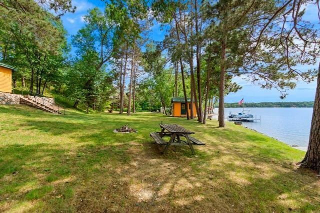 34779 County Road 39, Pequot Lakes, MN 56472 - view of green lawn with a water view and a fire pit
