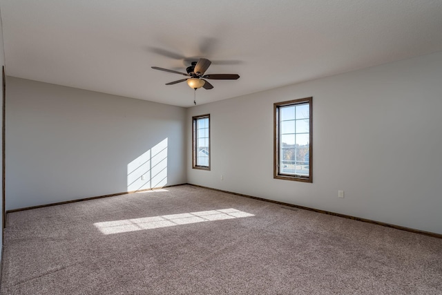 unfurnished room with light carpet and ceiling fan