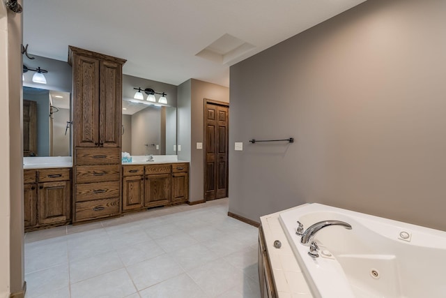 bathroom with vanity, tile patterned flooring, and a bathing tub