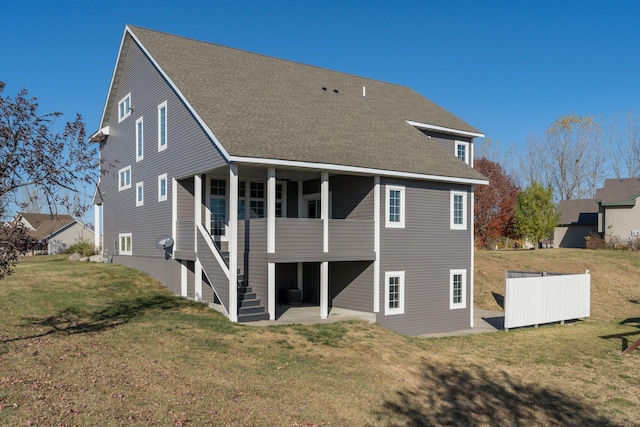 back of property featuring a yard, a patio, and central AC unit