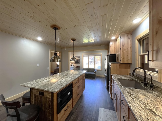 kitchen with a center island, wooden ceiling, sink, hanging light fixtures, and light stone counters