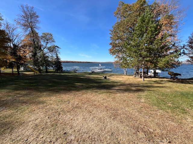8291 Boy Lake Dr NE, Remer, MN 56672 - view of green lawn featuring a water view and a dock