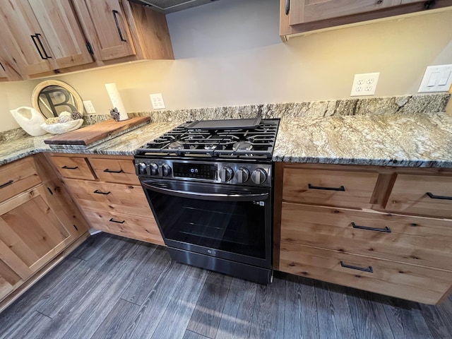 8291 Boy Lake Dr NE, Remer, MN 56672 - kitchen with gas range, dark wood finished floors, and light stone counters