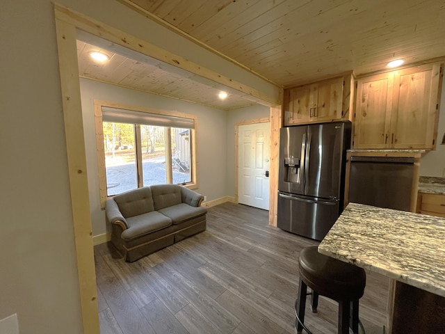 8291 Boy Lake Dr NE, Remer, MN 56672 - kitchen with stainless steel fridge with ice dispenser, baseboards, wood ceiling, wood finished floors, and light brown cabinets