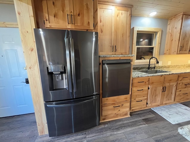 8291 Boy Lake Dr NE, Remer, MN 56672 - kitchen with stainless steel fridge, a sink, oven, dark wood-style floors, and light stone countertops