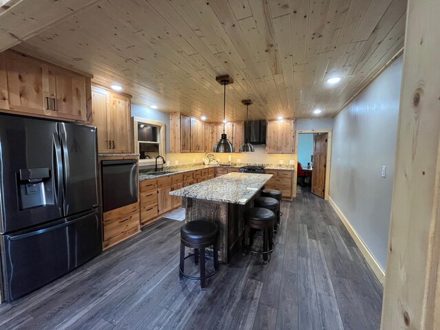 8291 Boy Lake Dr NE, Remer, MN 56672 - kitchen featuring fridge with ice dispenser, stainless steel oven, a breakfast bar area, dark wood-style flooring, and a center island