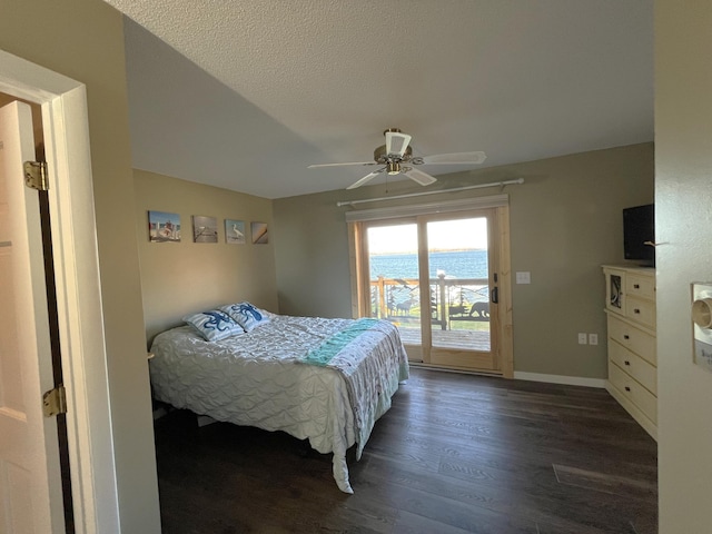 8291 Boy Lake Dr NE, Remer, MN 56672 - bedroom with access to outside, dark wood finished floors, a ceiling fan, a textured ceiling, and baseboards