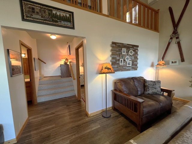 8291 Boy Lake Dr NE, Remer, MN 56672 - living area with wood finished floors, baseboards, stairs, and a high ceiling