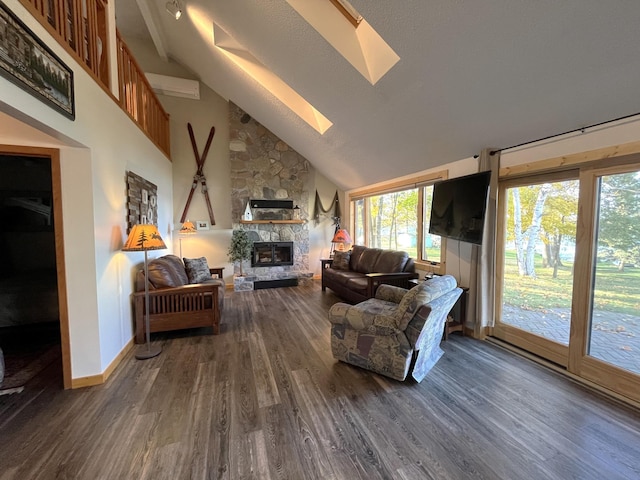 8291 Boy Lake Dr NE, Remer, MN 56672 - living room with a skylight, a fireplace, dark wood-type flooring, baseboards, and high vaulted ceiling