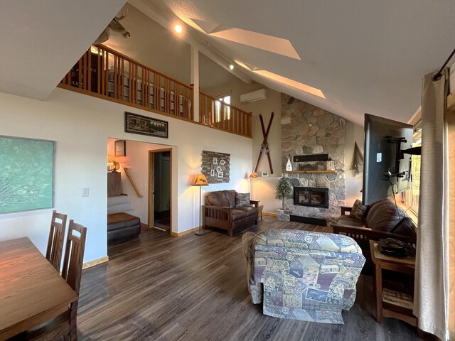 8291 Boy Lake Dr NE, Remer, MN 56672 - living area with stairway, a wall mounted AC, a fireplace, wood finished floors, and baseboards