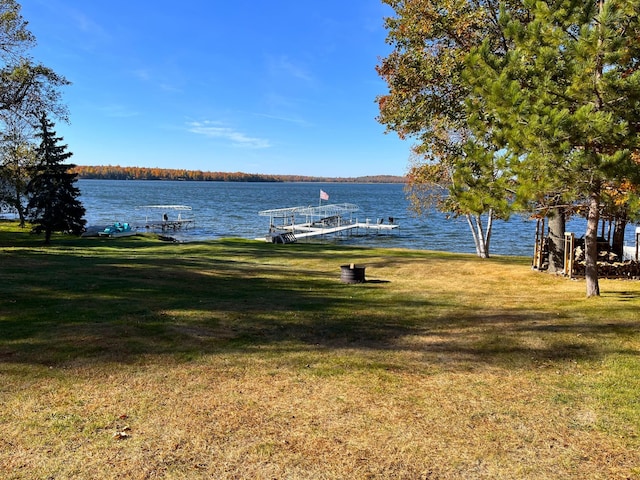 8291 Boy Lake Dr NE, Remer, MN 56672 - dock featuring a yard and a water view