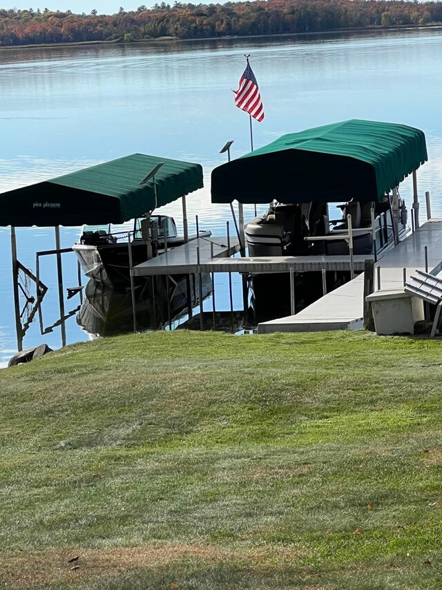 8291 Boy Lake Dr NE, Remer, MN 56672 - dock area featuring boat lift, a yard, and a water view