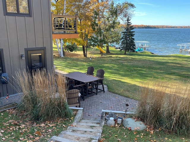 8291 Boy Lake Dr NE, Remer, MN 56672 - view of green lawn with a water view, a patio area, and a balcony