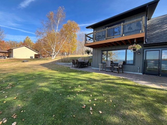 8291 Boy Lake Dr NE, Remer, MN 56672 - view of green lawn featuring a balcony and a patio