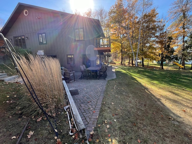 8291 Boy Lake Dr NE, Remer, MN 56672 - view of side of home with a patio area and a yard