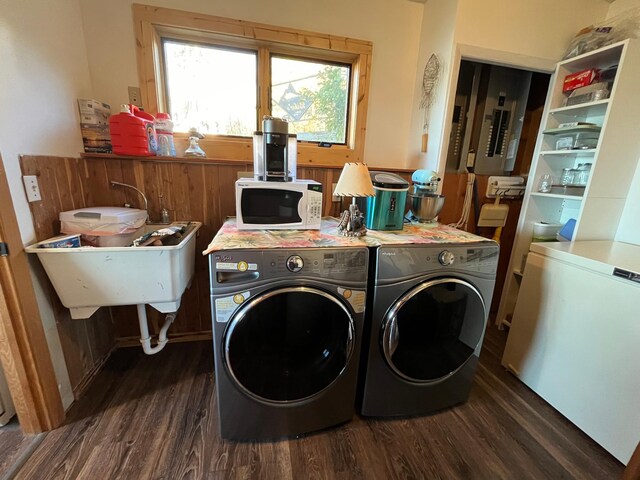 8291 Boy Lake Dr NE, Remer, MN 56672 - laundry area featuring dark wood finished floors, washer and clothes dryer, and healthy amount of natural light