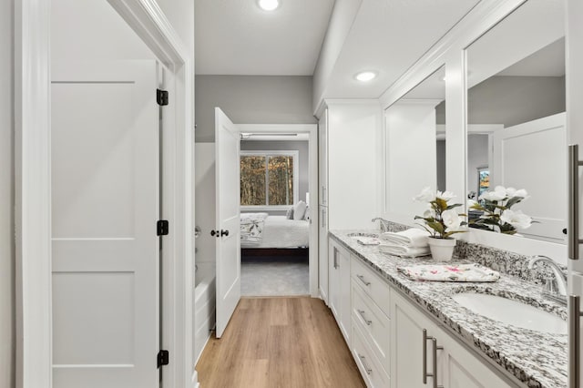 bathroom with vanity and wood-type flooring