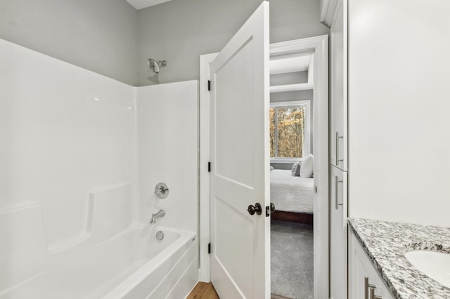 bathroom featuring vanity and shower / bathtub combination