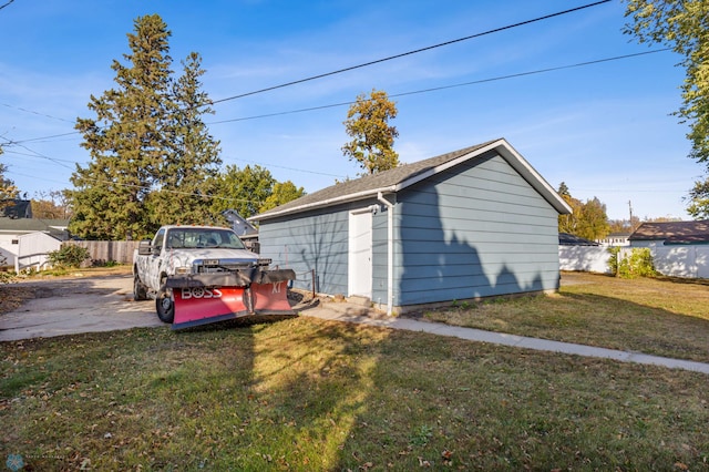 garage featuring a lawn