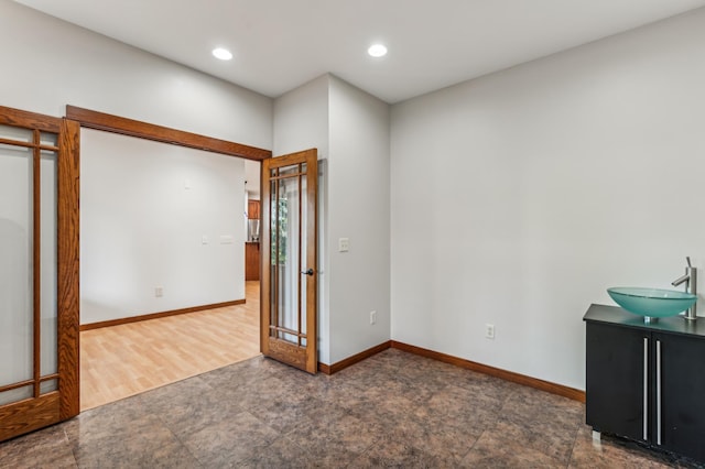 interior space with sink and dark hardwood / wood-style flooring