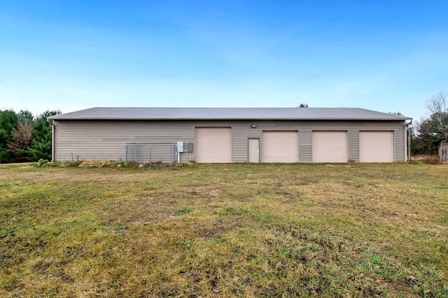 garage featuring a yard