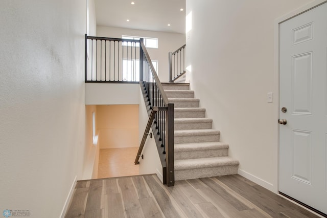 staircase featuring hardwood / wood-style floors