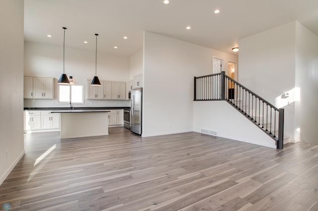 unfurnished living room with light hardwood / wood-style flooring