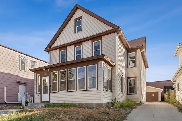 front of property featuring an outdoor structure and a garage