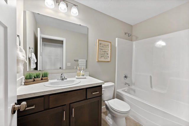 full bathroom with toilet, vanity, and washtub / shower combination