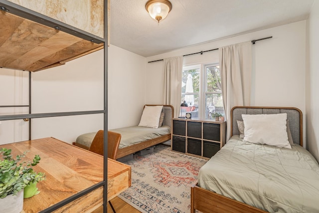 bedroom featuring wood-type flooring