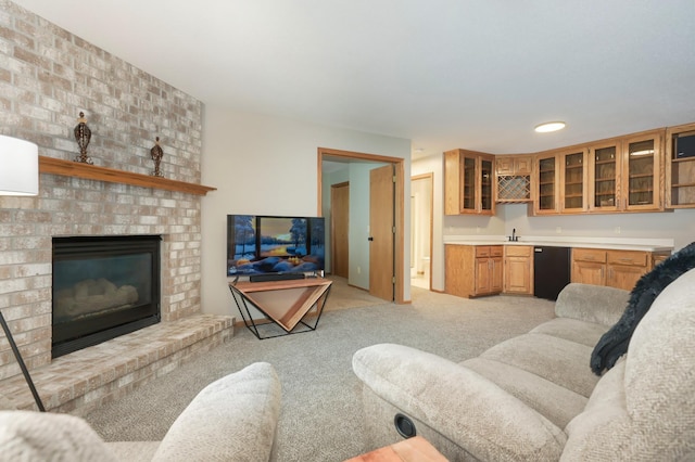 carpeted living room featuring a fireplace and indoor wet bar