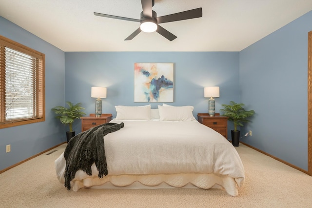 carpeted bedroom featuring ceiling fan