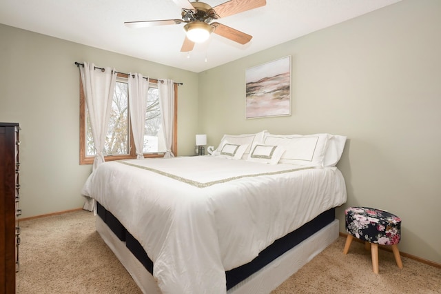 bedroom featuring ceiling fan and light colored carpet