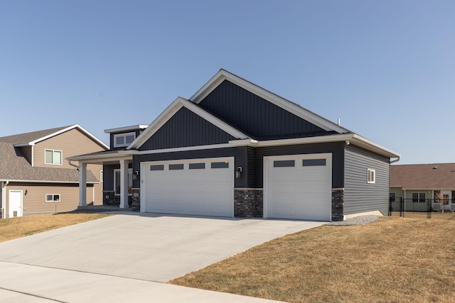 view of front facade with a front yard and a garage