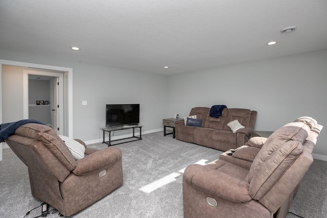 carpeted living room with a textured ceiling