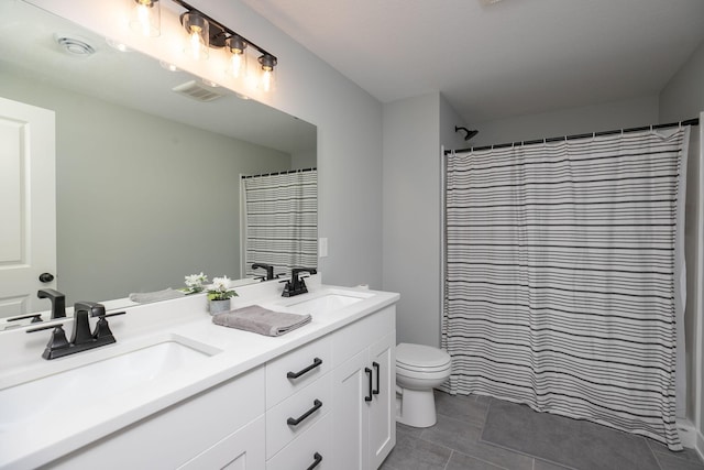 bathroom with vanity, curtained shower, toilet, and tile patterned floors