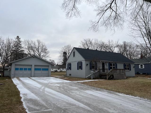 view of front of house featuring an outdoor structure and a garage