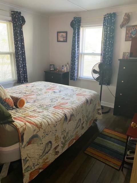 bedroom with wood-type flooring