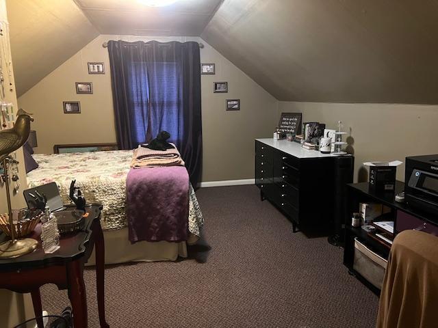 carpeted bedroom featuring vaulted ceiling