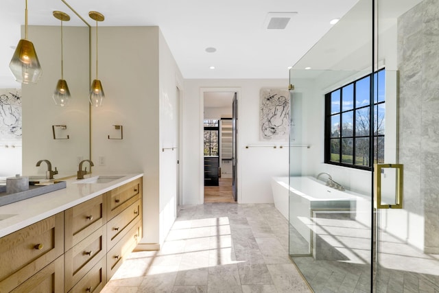 bathroom with a bath and vanity