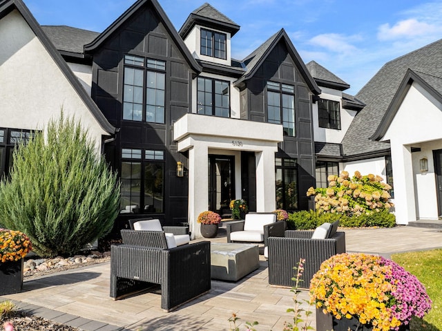 exterior space featuring an outdoor living space and a patio area